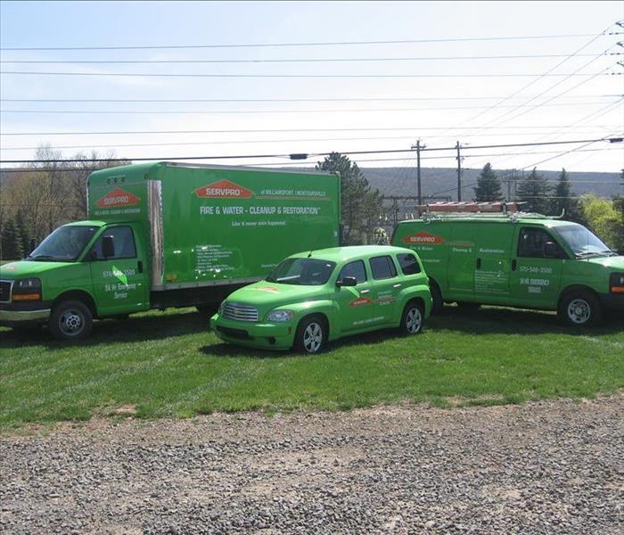 Green SERVPRO fleet van, car and truck
